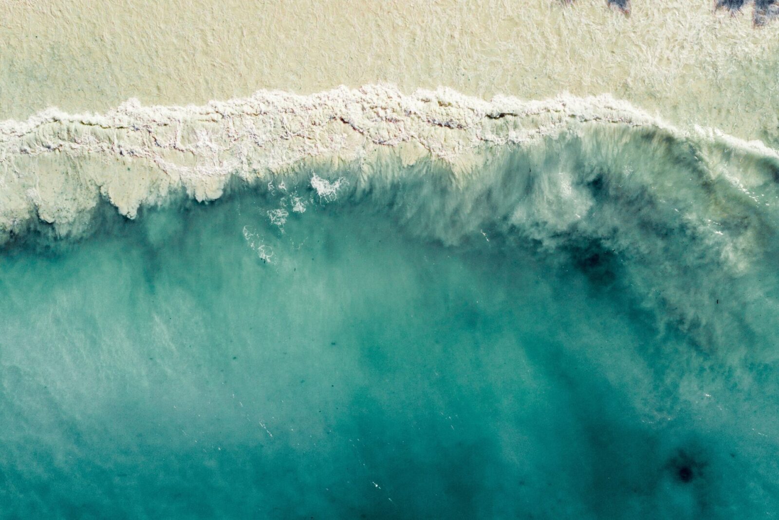 White sand and turquoise Indian Ocean water at Diani Beach, Kenya